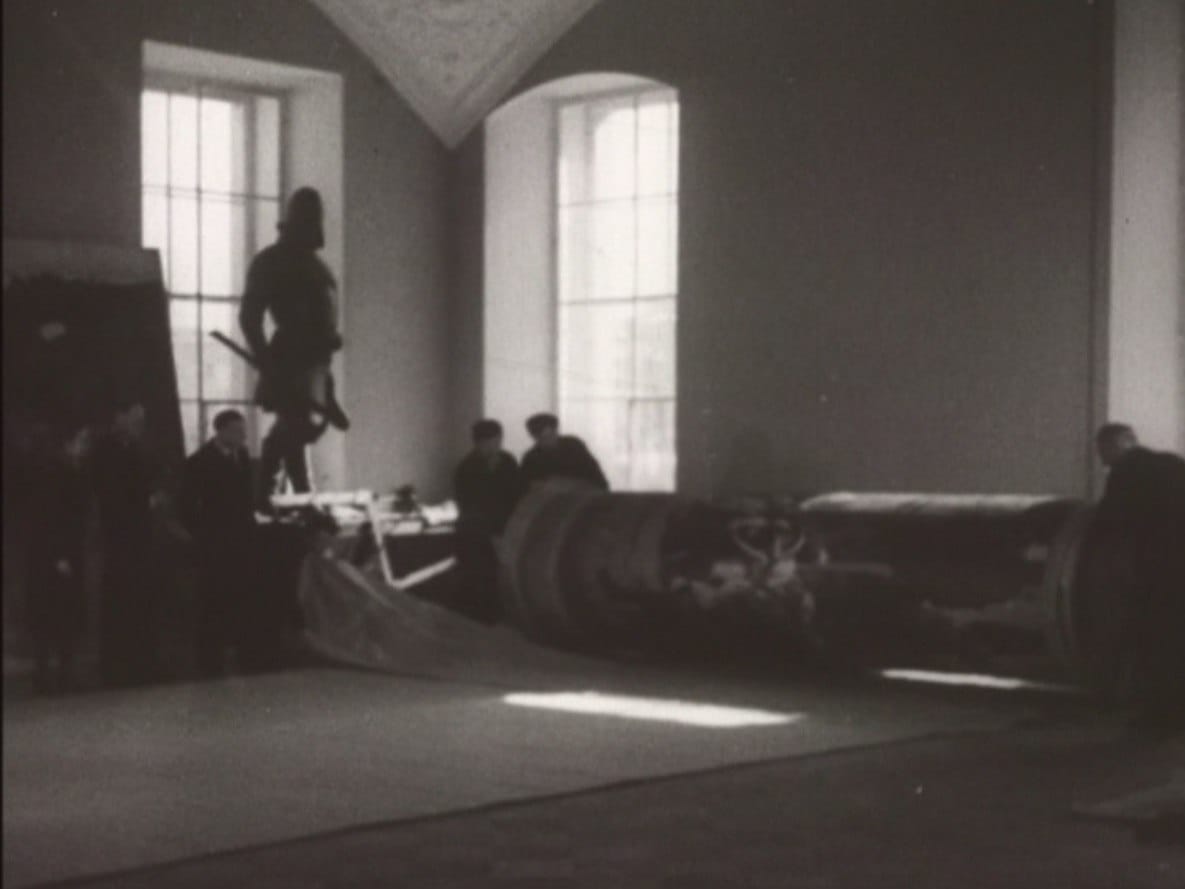 A photograph from the Russian Museum archive: this is how large canvases were prepared for conservation and transport, rolled onto perfectly smooth plywood drums, interleaved with thick paper, with the edges of the canvases stitched together