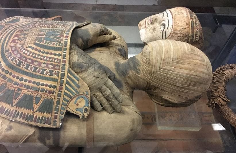 Beneath the Mask, the Mummy's Face Is Covered