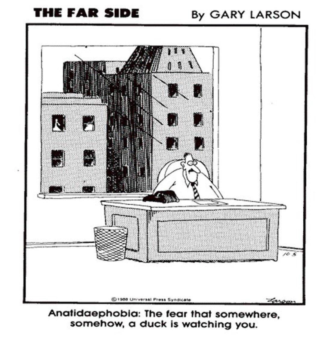 Black-and-white Gary Larson comic “The Far Side”: a frightened man at a desk in an office, with buildings and windows outside.