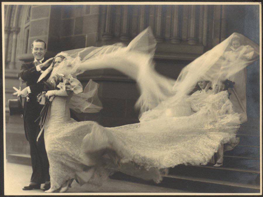 Stumbled upon this photograph by chance and may have found the longest wedding veil in history; its owner was the British-born Australian dancer and actress Madge Elliott