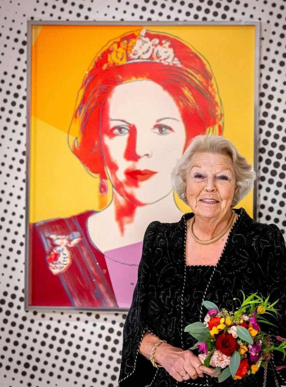 Former Queen of the Netherlands, Princess Beatrix (reigned from 1980; abdicated in 2013 in favour of her son, Willem-Alexander), beside her own portraits by Andy Warhol