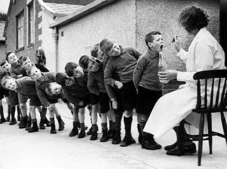 French schoolchildren waiting for their weekly dose of cod liver oil, 1948