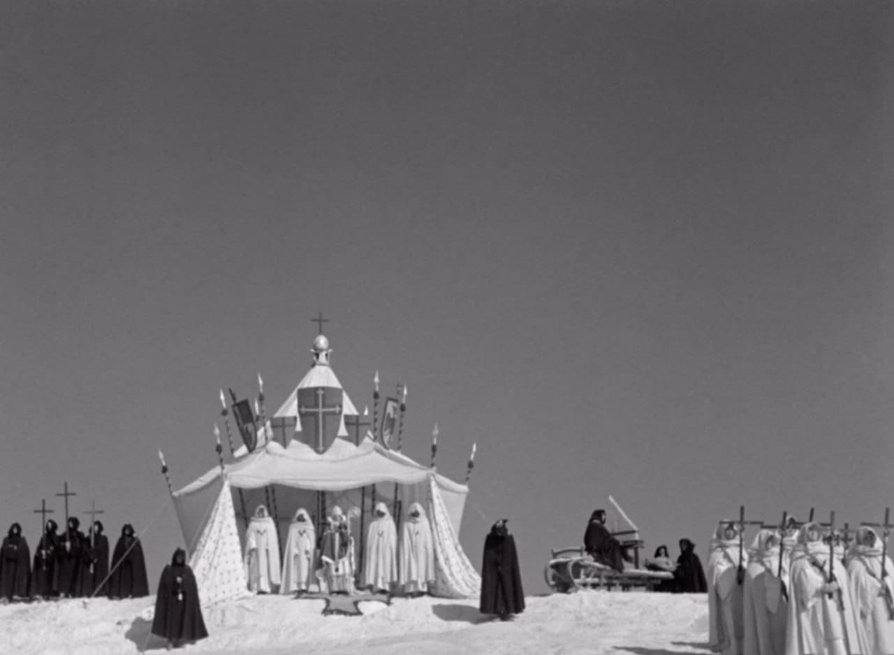 The bishop's tent and the whole setting of the scene before the Russian host's battle with the Livonian dog-knights in the film "Alexander Nevsky" recall the pavilions of the Saracens, especially as the snow looks rather more like sand