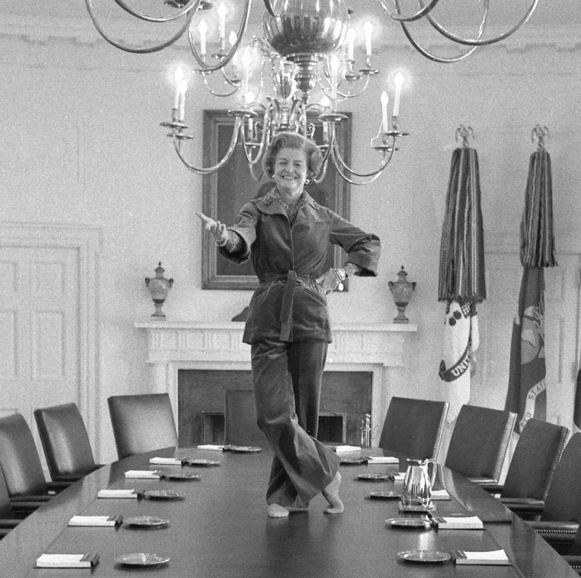 Betty Ford, wife of the 38th President of the United States, Gerald Ford, dances on a table in the White House in 1977