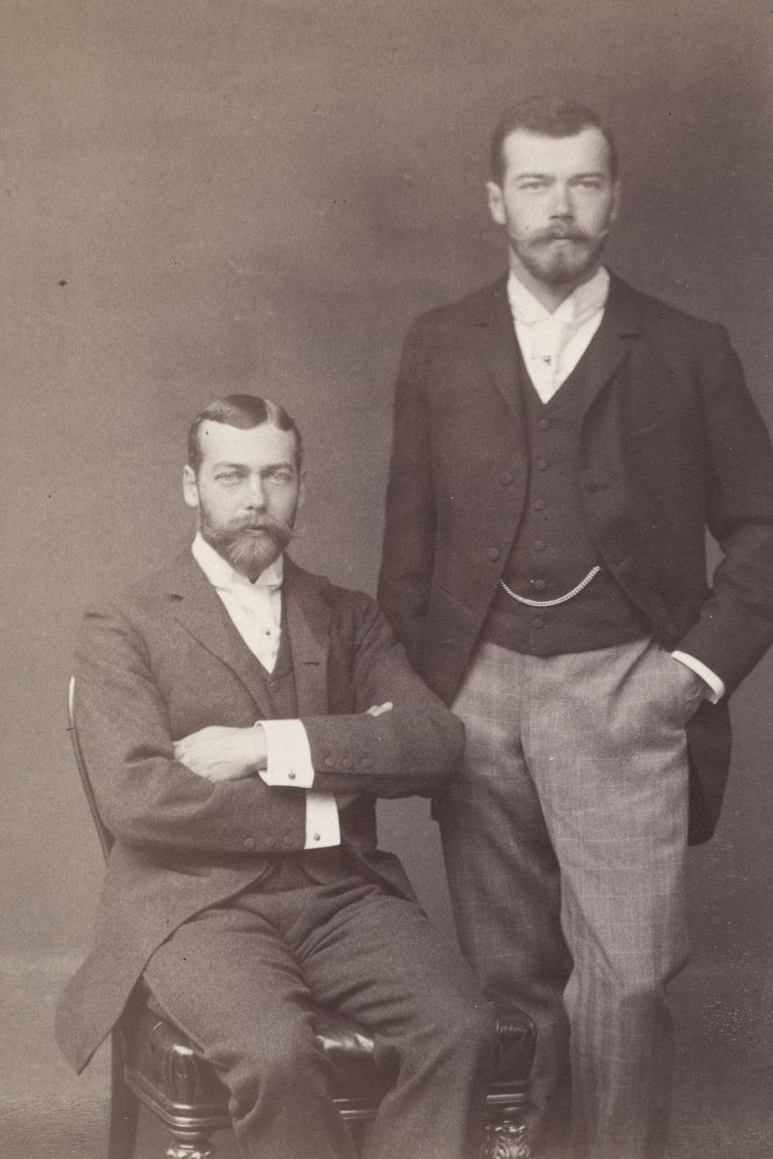 Nicholas II and George V are such card-players, swapping places in identical photographs to confuse everyone around them: the Mary-Kate and Ashley Olsen of their day