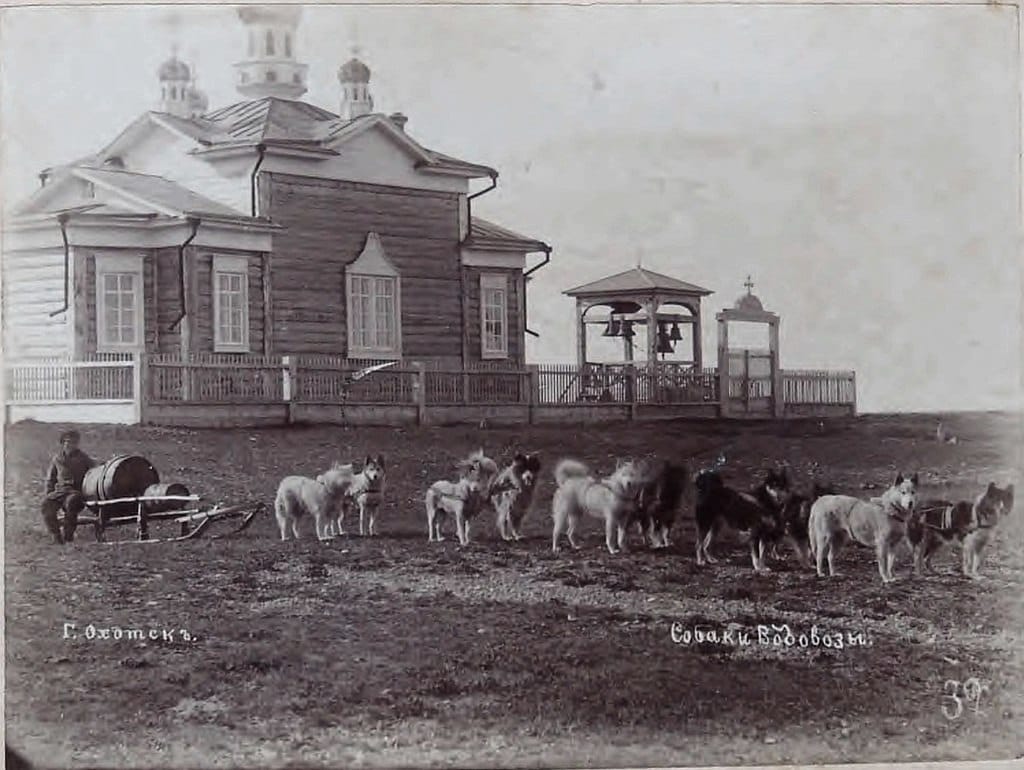 Water-carrier dogs before the Church of the Transfiguration of the Saviour in the town of Okhotsk, 1880s