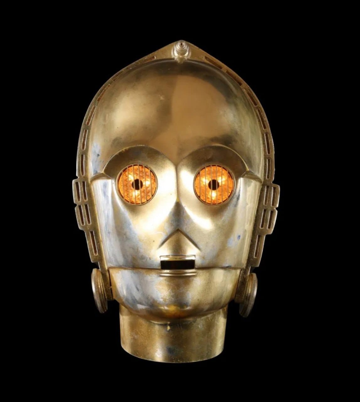 At a Los Angeles auction, the glowing head of the humanoid protocol droid C-3PO from "Star Wars: Episode V – The Empire Strikes Back" sold for more than a million dollars against an initial estimate of 350,000–700,000