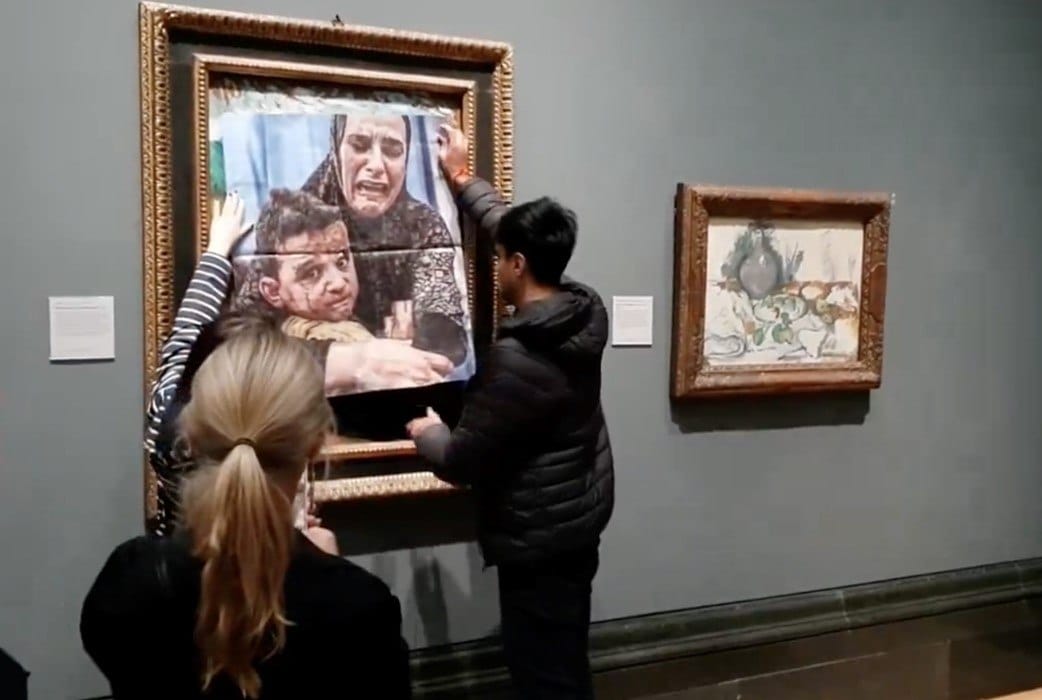 The vandals who tried to attach a propaganda photograph to Picasso's 1901 "Motherhood" and poured paint on the floor of the National Gallery have been found guilty of criminal damage