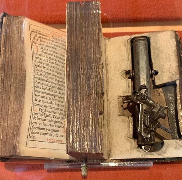 Francesco Morosini's Bible with a pistol hidden inside its pages
