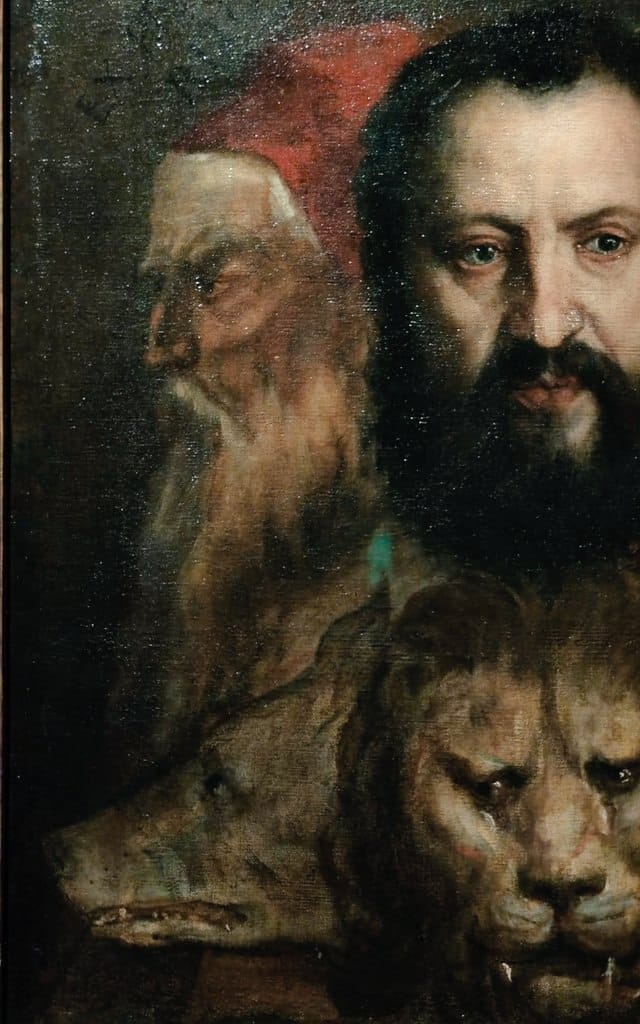 Détail de peinture à l'huile : un vieillard à bonnet rouge de profil près d'un homme barbu de face, au-dessus de têtes de loup et de lion.