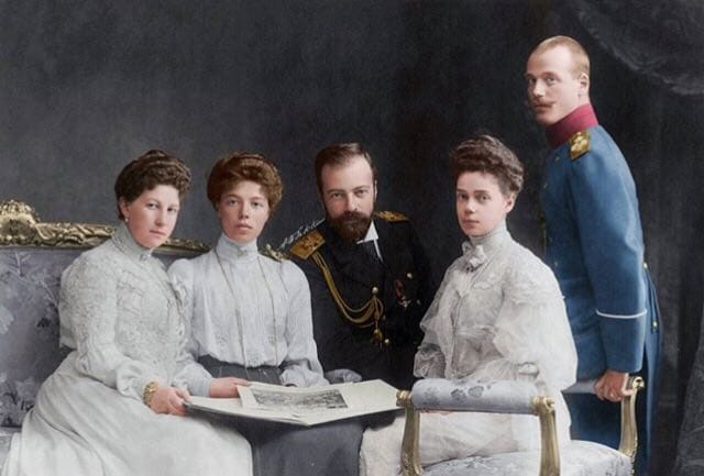 Someone here has said I do not look much like Sandro, but Grand Duke Alexander Mikhailovich, standing between Maria Georgievna with Olga Alexandrovna and Xenia Alexandrovna with Mikhail Alexandrovich, does look quite like him?