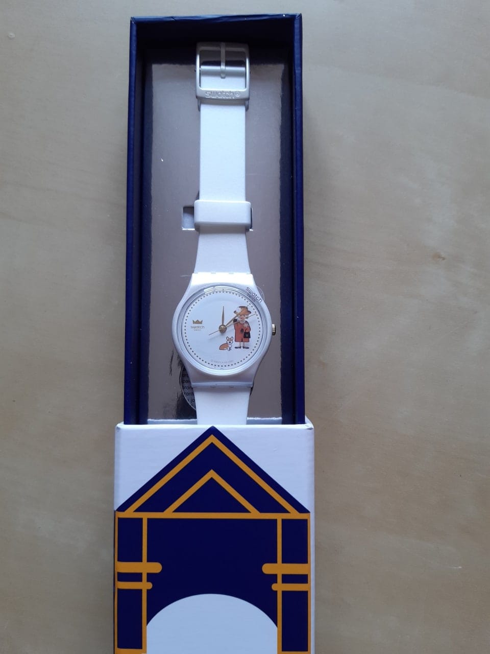 If anyone is desperate to give me a present but has no idea what: this is what the Swatch watch with Elizabeth II and a well-fed corgi looks like