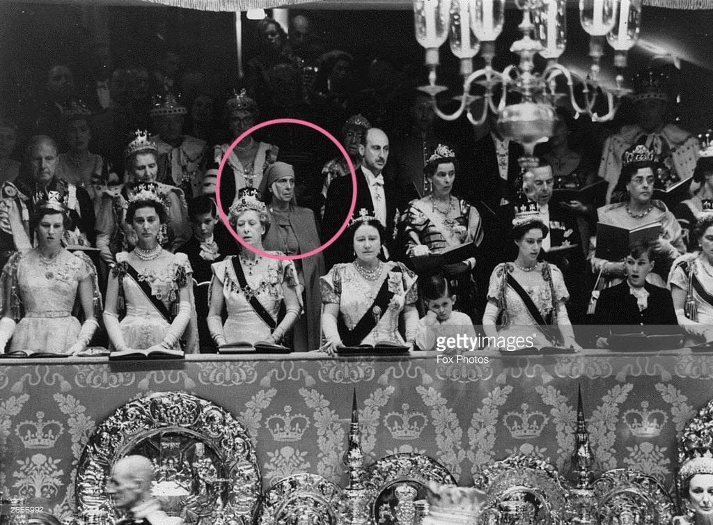 A woman in a nun's habit among personages in crowns and diamonds: Alice of Battenberg, mother of Prince Philip and founder of the sisterhood of Greek Orthodox nuns, the Order of Martha and Mary, at the coronation of her daughter-in-law, Elizabeth II